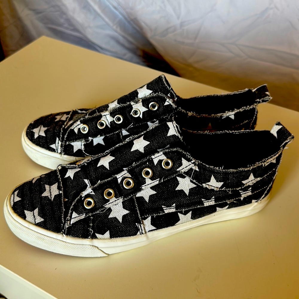Women’s size 8 Black with white stars slip ons by Corkys